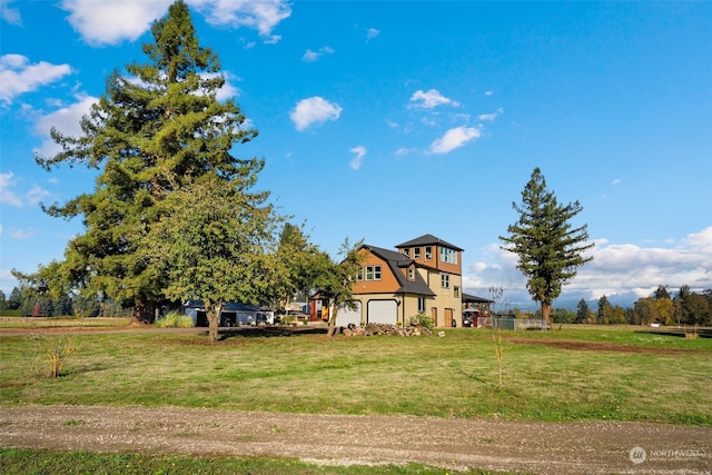 view of yard featuring a garage