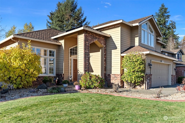 view of front of home with a garage and a front yard