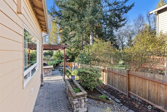 view of yard with a pergola and a patio area