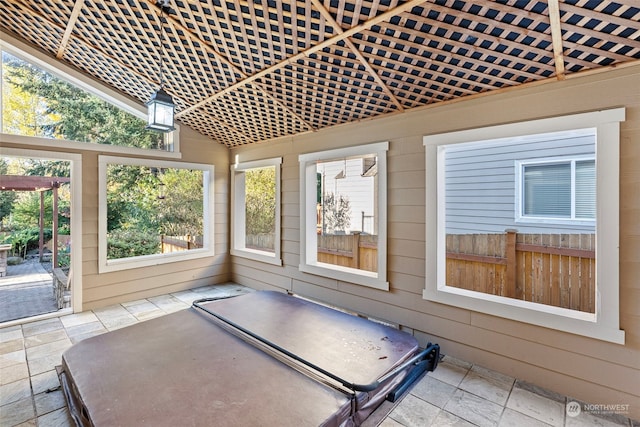 unfurnished sunroom with vaulted ceiling