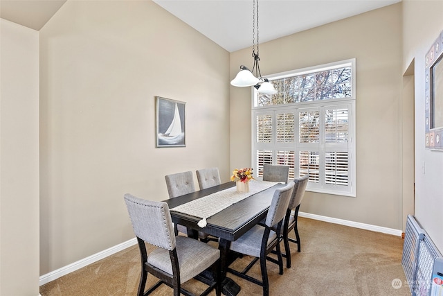 view of carpeted dining area