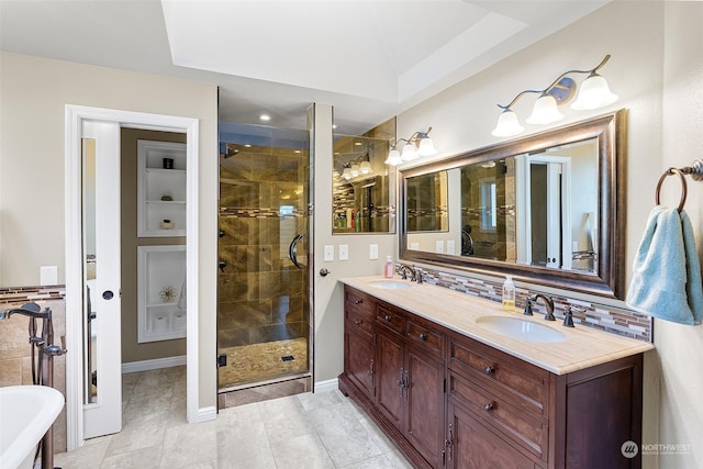 bathroom with tile patterned flooring, decorative backsplash, vanity, and independent shower and bath