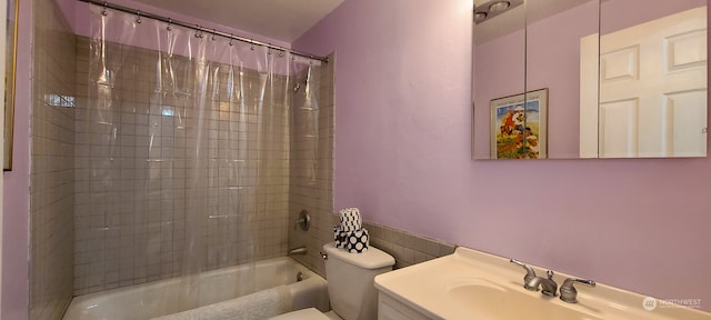 full bathroom with vanity, toilet, and shower / bath combo with shower curtain