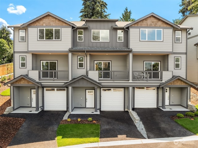 view of front of house featuring a balcony and a garage