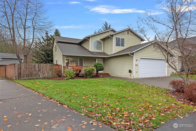 front facade featuring a porch, a garage, and a front yard