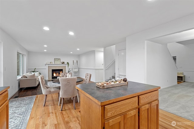 kitchen with a center island and light hardwood / wood-style flooring