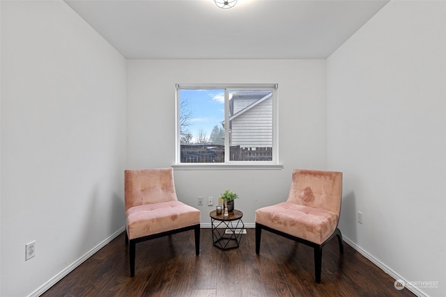 living area with hardwood / wood-style flooring