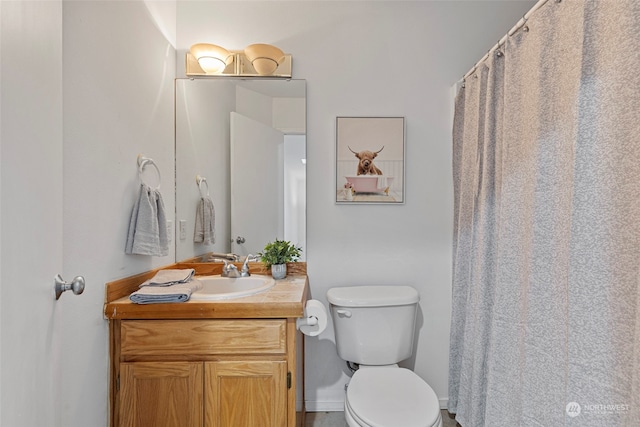 bathroom with vanity and toilet