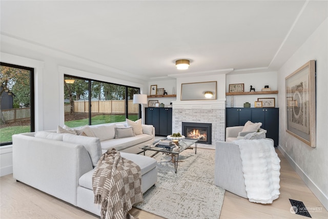 living room featuring a fireplace and light hardwood / wood-style floors