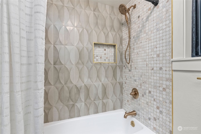 bathroom featuring shower / bathtub combination with curtain