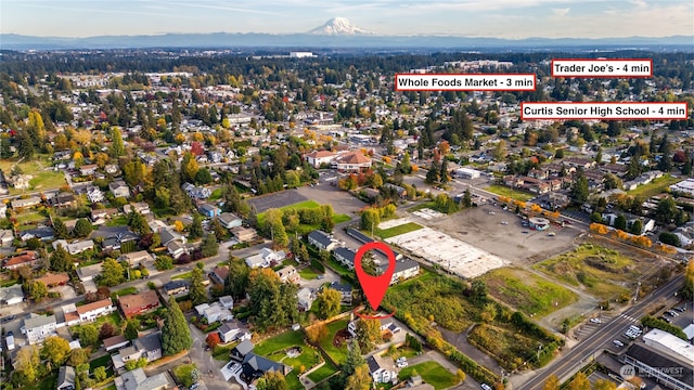 birds eye view of property featuring a mountain view