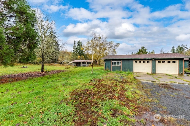 view of front of house with a garage and a front yard