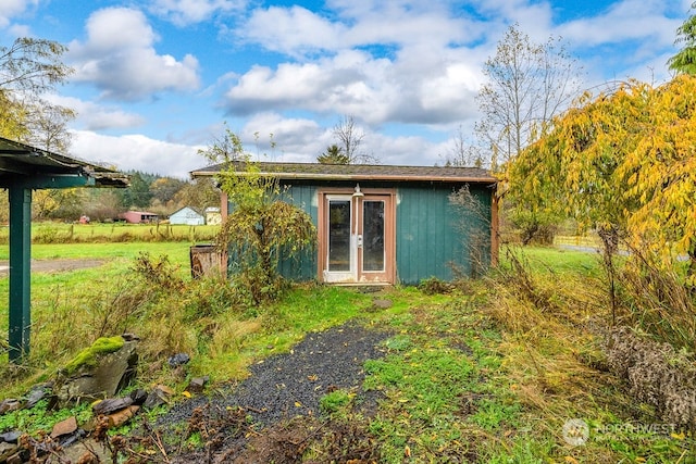 back of property with a storage unit