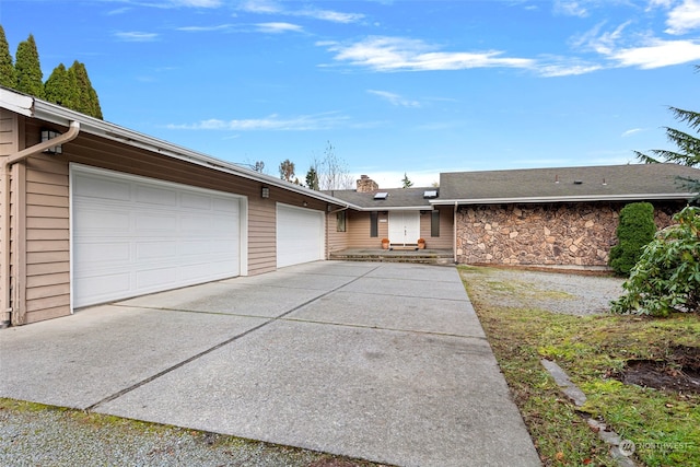 single story home featuring a garage