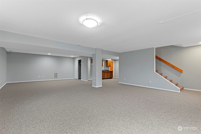 basement featuring carpet flooring