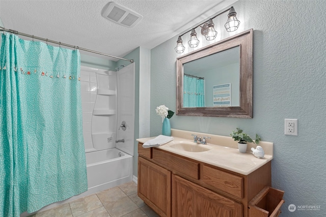 bathroom featuring tile patterned floors, vanity, shower / bath combo, and a textured ceiling