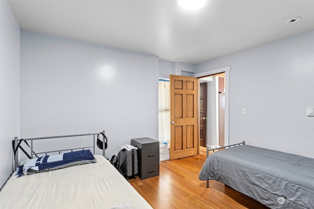 bedroom with light hardwood / wood-style floors