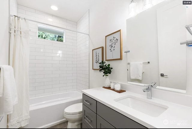 full bathroom with vanity, toilet, and shower / tub combo with curtain