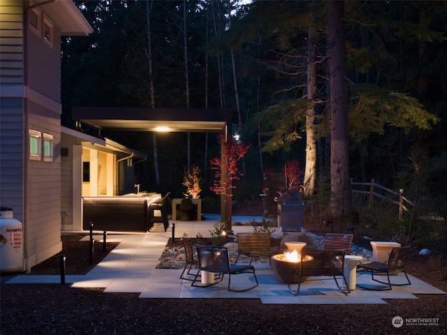 view of patio / terrace featuring an outdoor fire pit