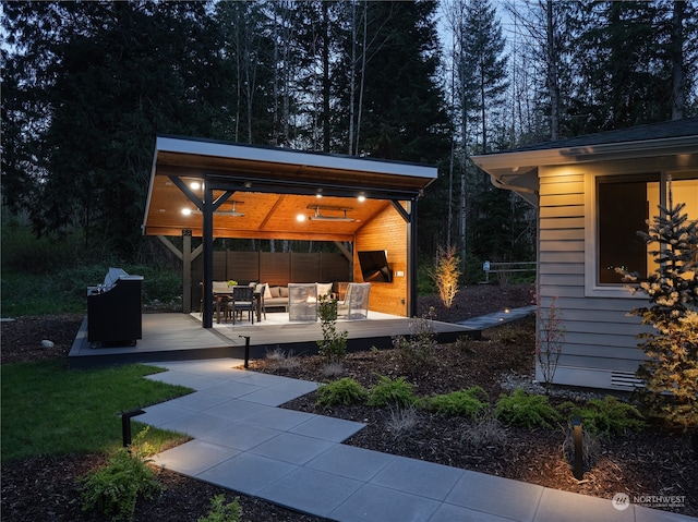 view of yard with outdoor lounge area and a deck