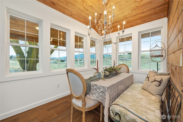 sunroom / solarium with wooden ceiling, a chandelier, and plenty of natural light