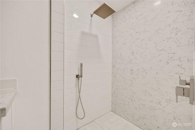 bathroom with a tile shower