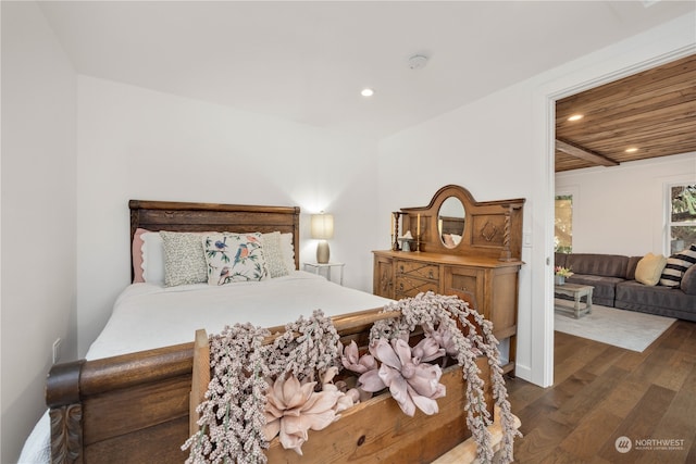 bedroom with dark hardwood / wood-style flooring and wooden ceiling