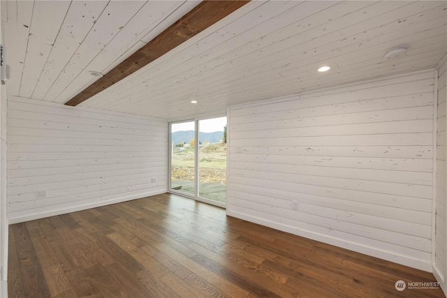 384 Washington St, Manson, WA 98831 - empty room featuring wooden ceiling, wood walls, wood finished floors, a mountain view, and baseboards