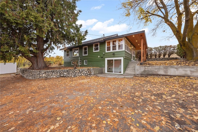 back of property with a patio area