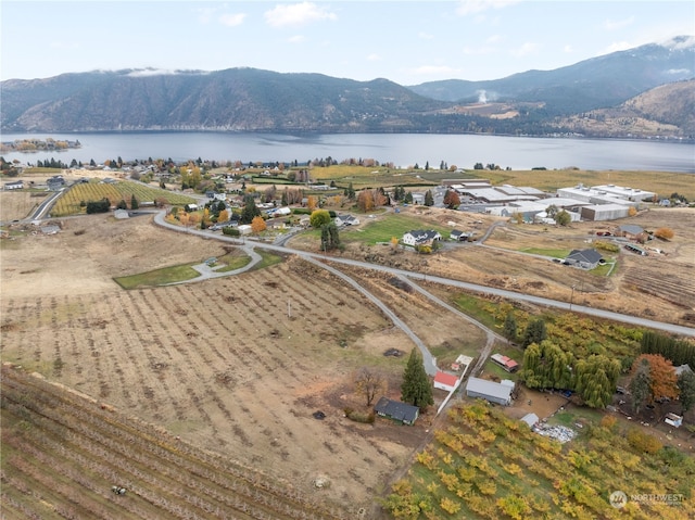 drone / aerial view with a water and mountain view