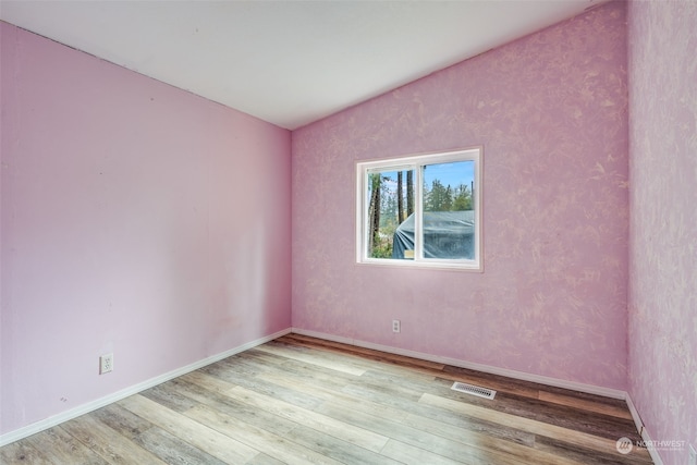 unfurnished room featuring light hardwood / wood-style flooring