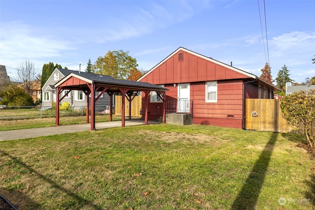 back of house with a yard and a gazebo