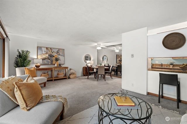 living room with light colored carpet and ceiling fan