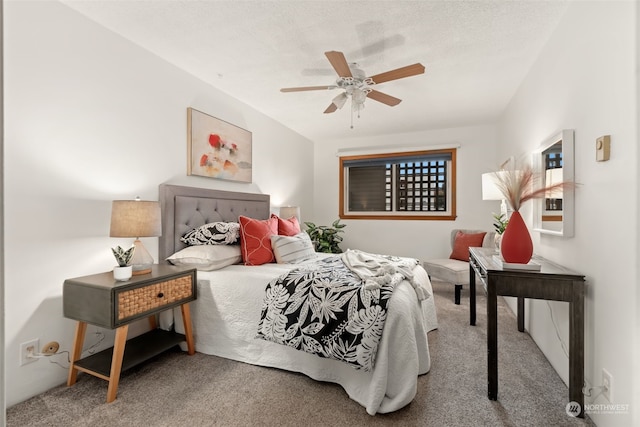 bedroom featuring ceiling fan and carpet floors