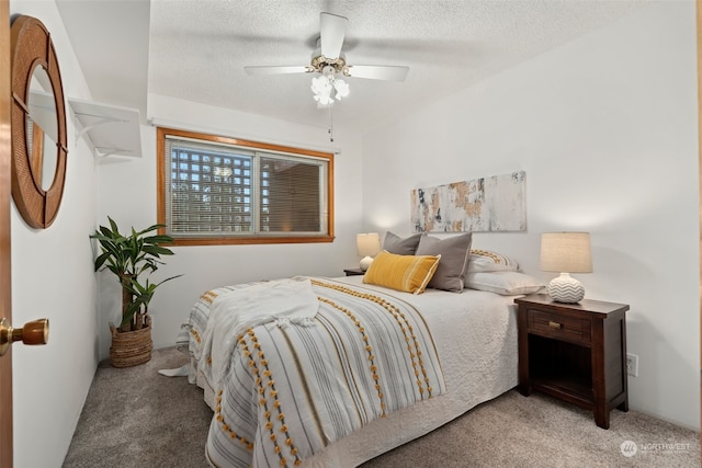 bedroom with carpet flooring, a textured ceiling, and ceiling fan