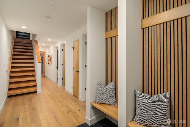 mudroom with light hardwood / wood-style floors