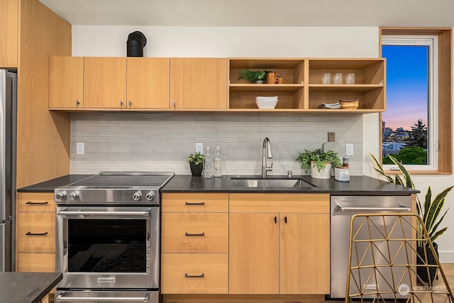 kitchen featuring decorative backsplash, sink, and stainless steel appliances