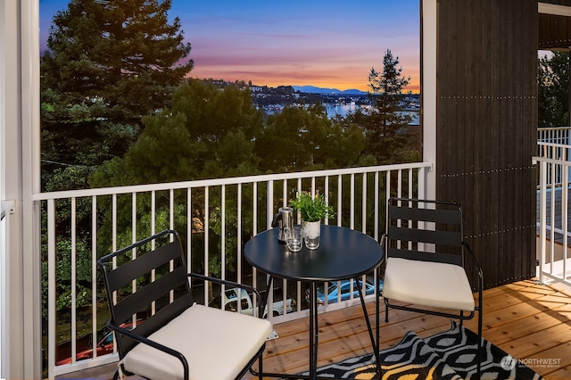 view of balcony at dusk