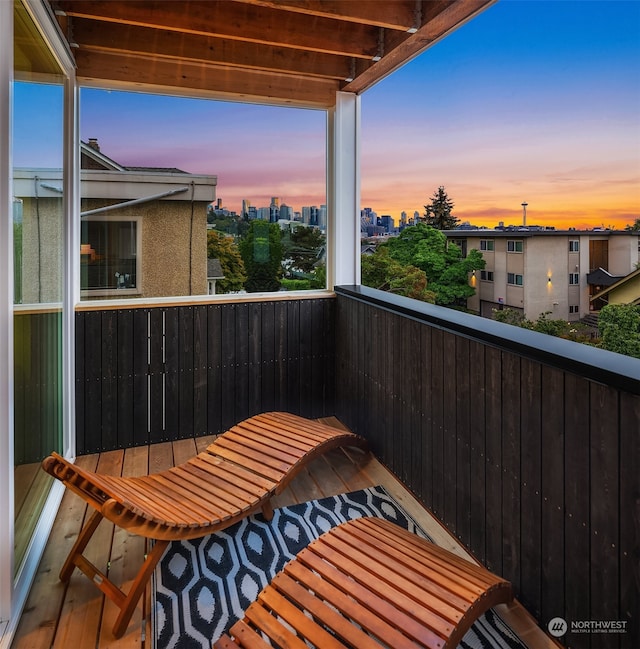 view of balcony at dusk