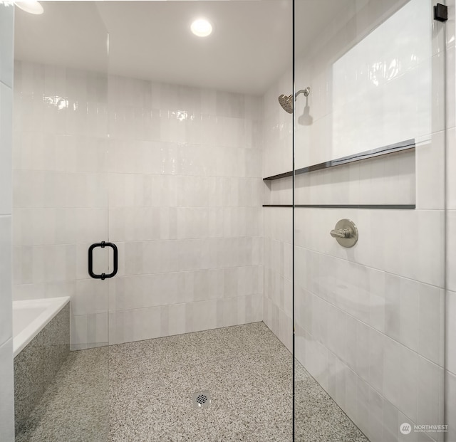 bathroom featuring an enclosed shower