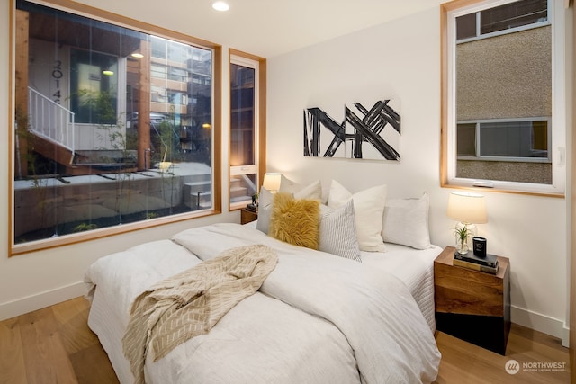 bedroom with light hardwood / wood-style flooring