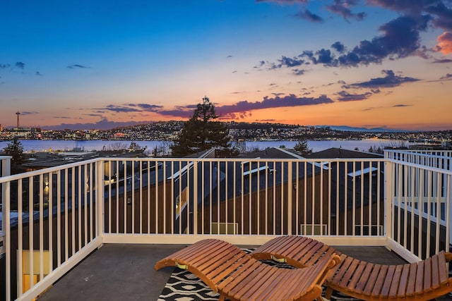 balcony at dusk with a water view