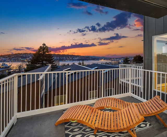 view of balcony at dusk