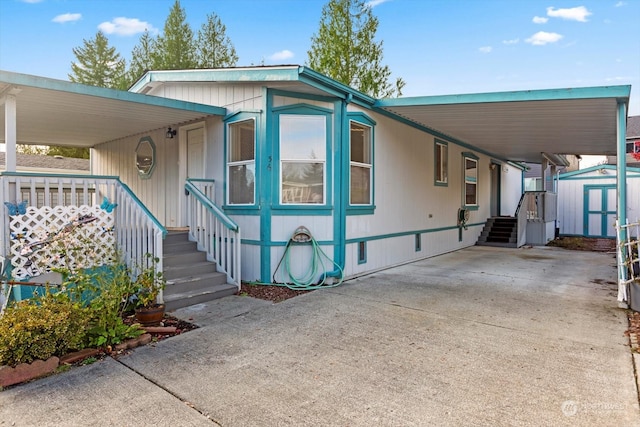 exterior space featuring a shed and a carport