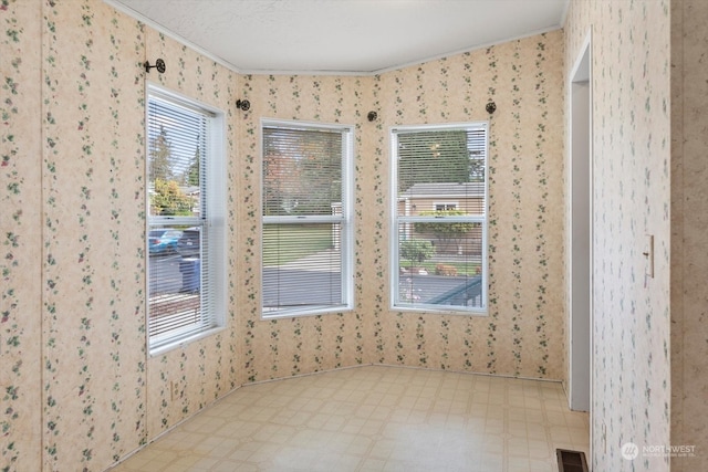 spare room with a textured ceiling