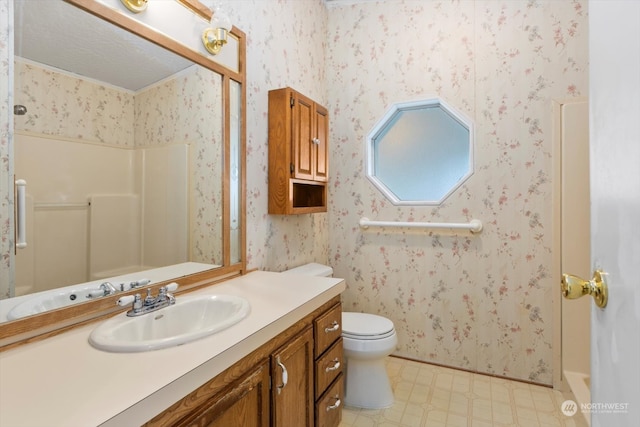 bathroom with walk in shower, vanity, and toilet