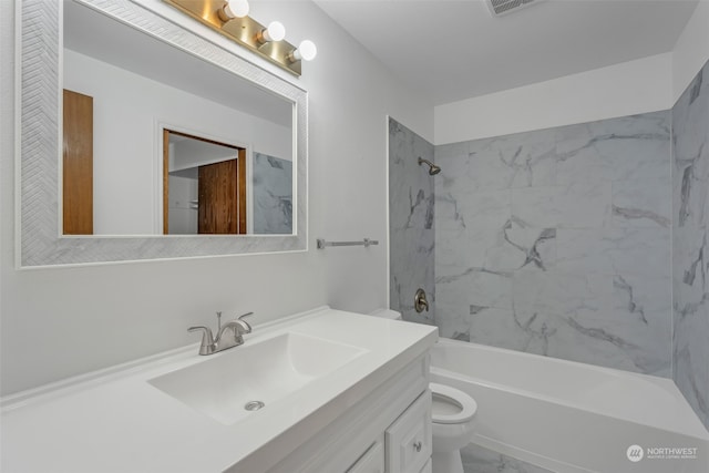 full bathroom with vanity, toilet, and tiled shower / bath combo