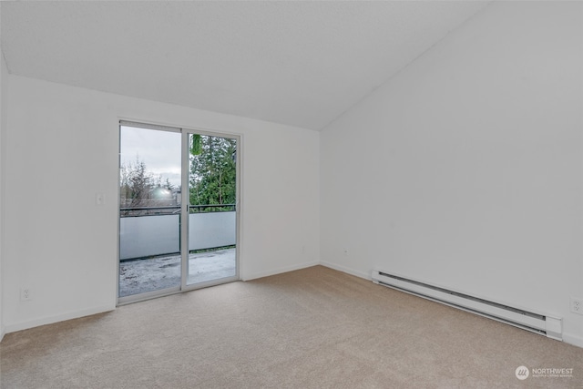 carpeted spare room featuring vaulted ceiling and a baseboard radiator