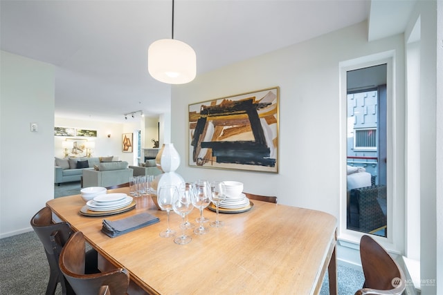 view of carpeted dining area