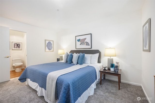 bedroom featuring carpet and ensuite bathroom